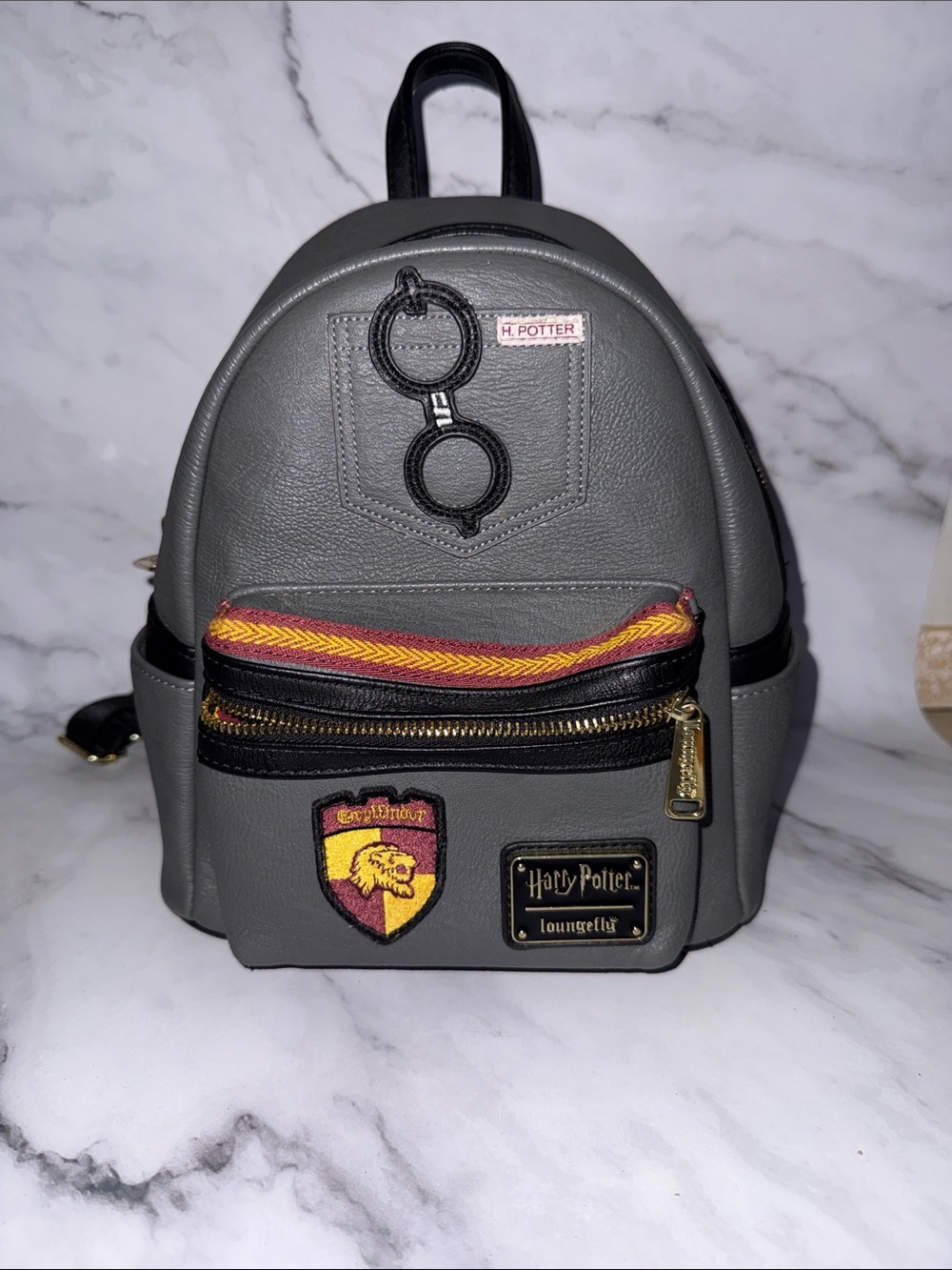 Loungefly Gray Harry Potter Gryffindor Mini Backpack with Red and Gold Accents